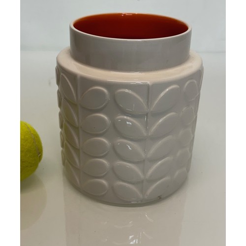 194 - An Orla Kiely vase with an orange glazed interior, 16 cm tall.

This lot is available for in-house s... 