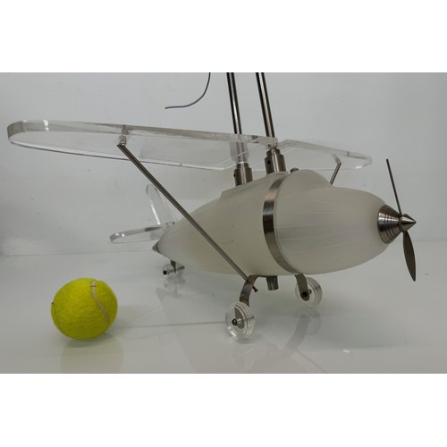 195 - Aeroplane ceiling light, moulded glass body 43 cm long 

This lot is available for in-house shipping