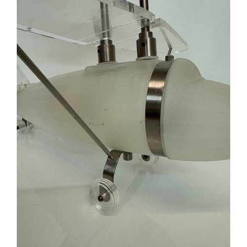 195 - Aeroplane ceiling light, moulded glass body 43 cm long 

This lot is available for in-house shipping