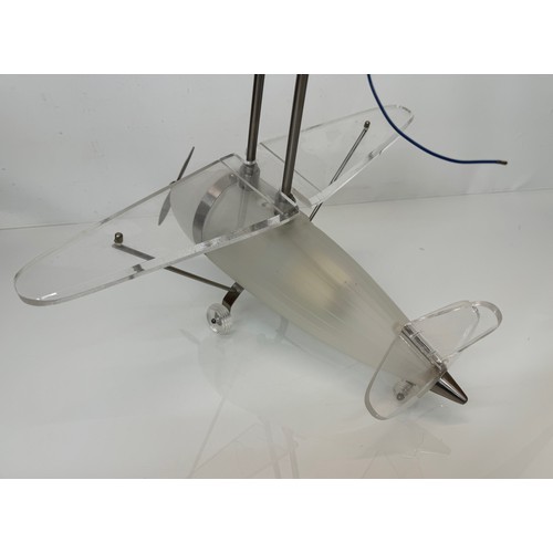 195 - Aeroplane ceiling light, moulded glass body 43 cm long 

This lot is available for in-house shipping