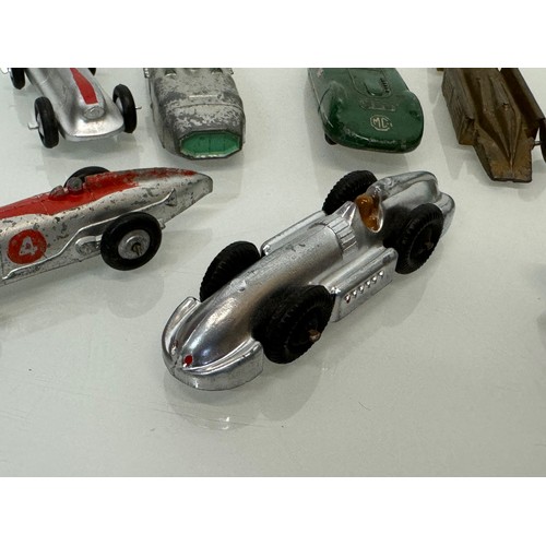 210 - A collection of die cast model land speed record race cars and motor racing cars. Dinky etc.

This l... 