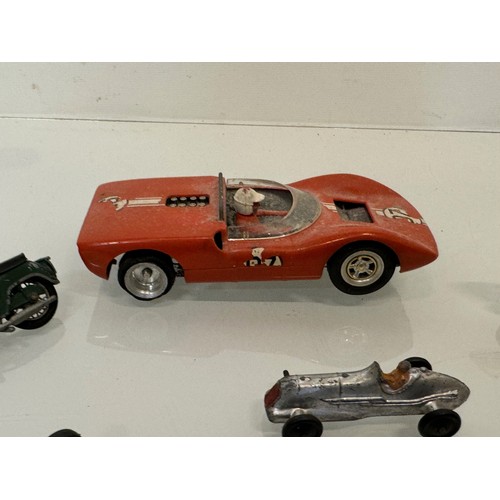 212 - A Scalextric slot car and a group of die cast single seat racing motor cars and motorcycle toys. Din... 