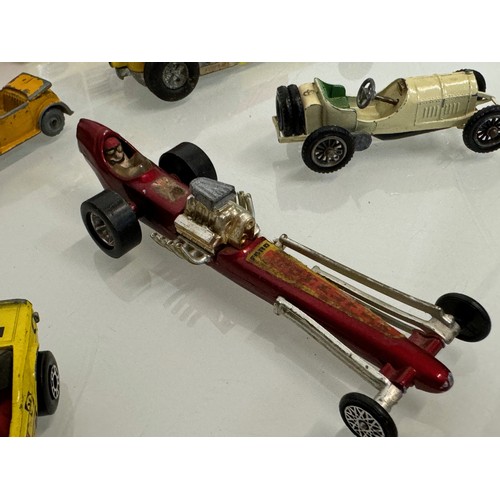 214 - Diecast toys, racing motor cars and a boxed Vanguard Austin A 35. Matchbox etc.

This lot is availab... 