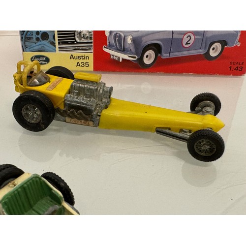 214 - Diecast toys, racing motor cars and a boxed Vanguard Austin A 35. Matchbox etc.

This lot is availab... 