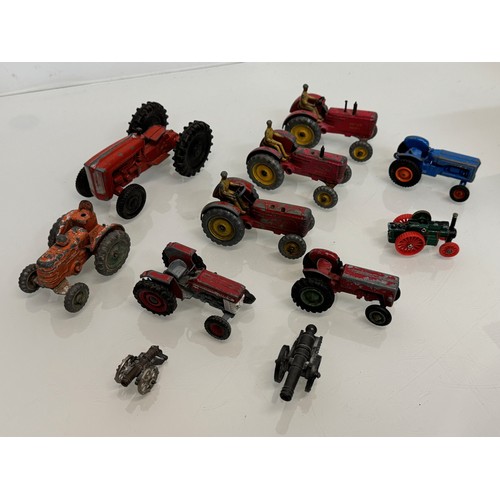 215 - Die cast toys, a collection of tractors and two model cannons. Dinky Corgi etc.

This lot is availab... 