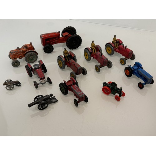 215 - Die cast toys, a collection of tractors and two model cannons. Dinky Corgi etc.

This lot is availab... 