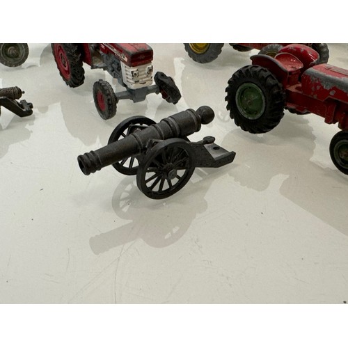 215 - Die cast toys, a collection of tractors and two model cannons. Dinky Corgi etc.

This lot is availab... 