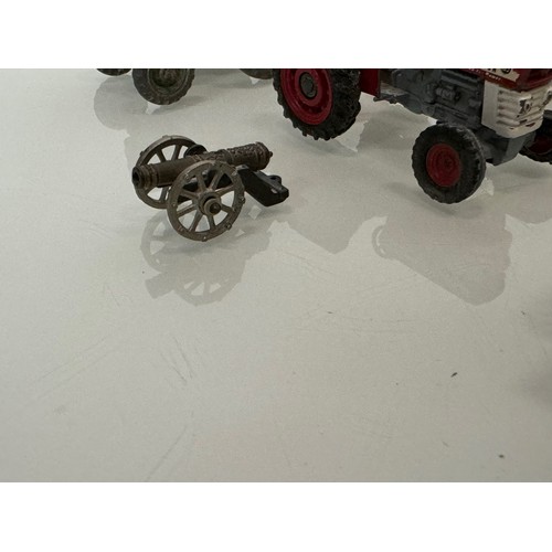 215 - Die cast toys, a collection of tractors and two model cannons. Dinky Corgi etc.

This lot is availab... 