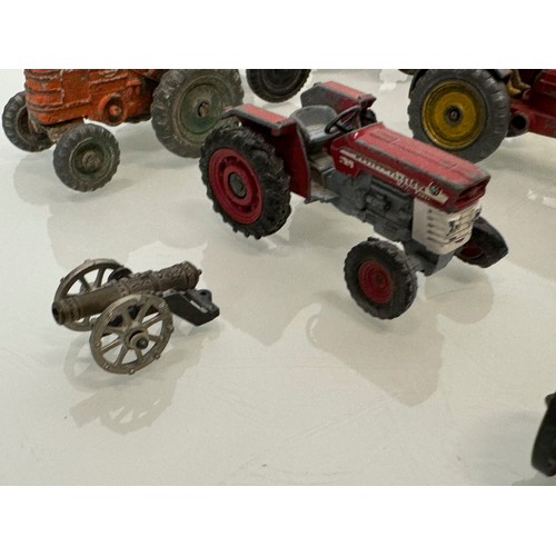 215 - Die cast toys, a collection of tractors and two model cannons. Dinky Corgi etc.

This lot is availab... 