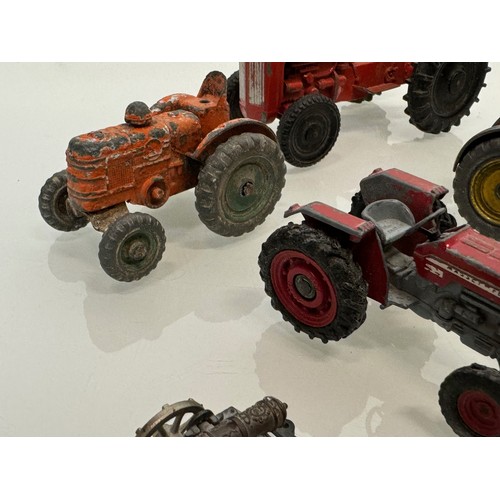 215 - Die cast toys, a collection of tractors and two model cannons. Dinky Corgi etc.

This lot is availab... 