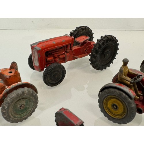 215 - Die cast toys, a collection of tractors and two model cannons. Dinky Corgi etc.

This lot is availab... 