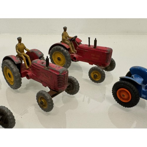 215 - Die cast toys, a collection of tractors and two model cannons. Dinky Corgi etc.

This lot is availab... 