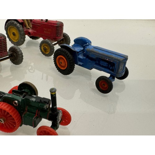 215 - Die cast toys, a collection of tractors and two model cannons. Dinky Corgi etc.

This lot is availab... 