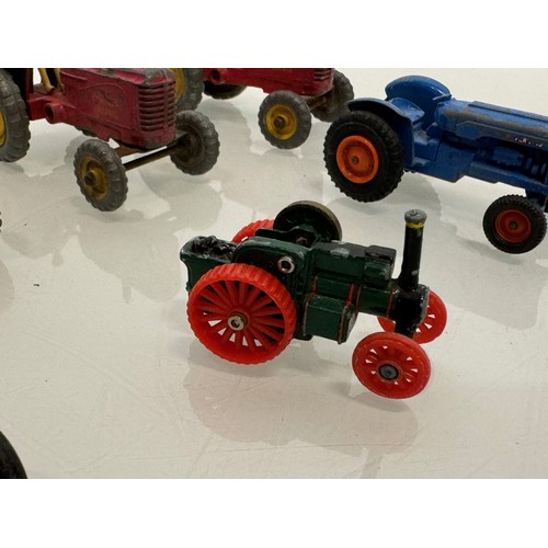 215 - Die cast toys, a collection of tractors and two model cannons. Dinky Corgi etc.

This lot is availab... 