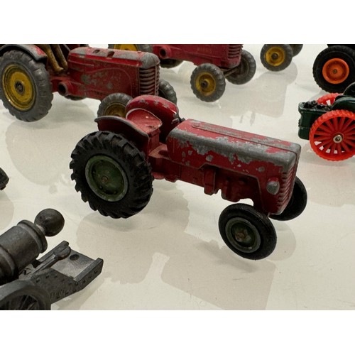 215 - Die cast toys, a collection of tractors and two model cannons. Dinky Corgi etc.

This lot is availab... 