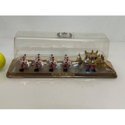 217 - A new old stock Royal Coronation coach model from Silver Jubilee year, 38 cm x 10 cm x 10 cm tall.

... 