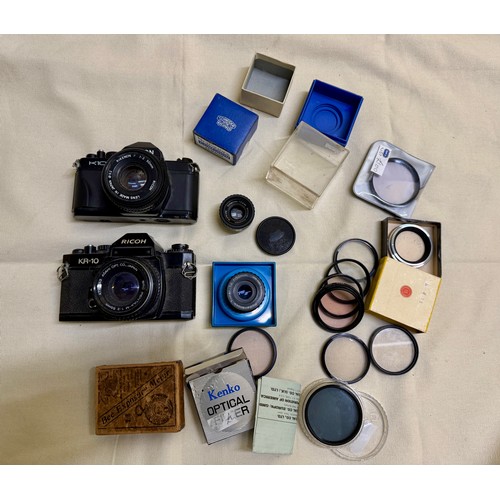 486 - A selection of photographic film equipment including SLR 35mm Film Cameras, Photographic enlarger le... 