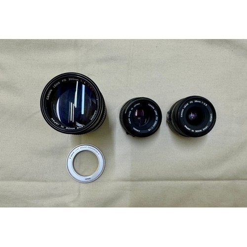 487 - Photographic equipment, A selection of lenses and a lens adapter for FD mount Canon 35mm Film Camera... 