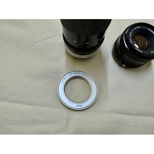 487 - Photographic equipment, A selection of lenses and a lens adapter for FD mount Canon 35mm Film Camera... 