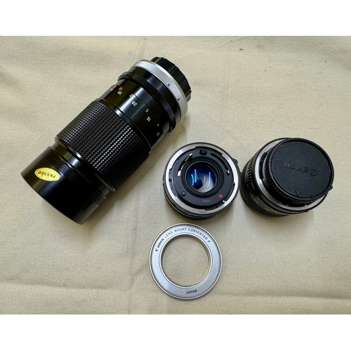 487 - Photographic equipment, A selection of lenses and a lens adapter for FD mount Canon 35mm Film Camera... 