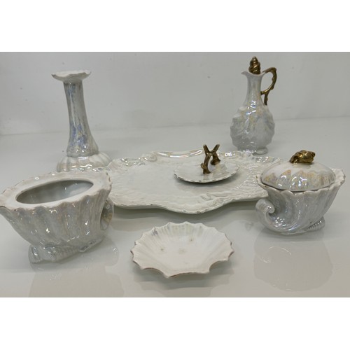 336 - Kitsch mid century shell form dressing table wares with a white lustre glaze.

This lot is available... 