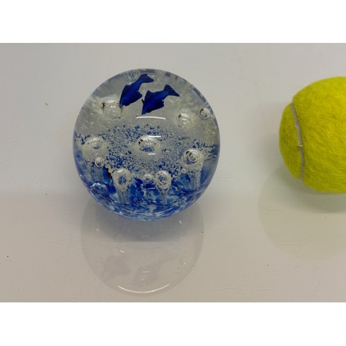 264 - A glass paperweight with blue fish set agains an oxigenated backdrop, 8 cm tall.

This lot is availa... 