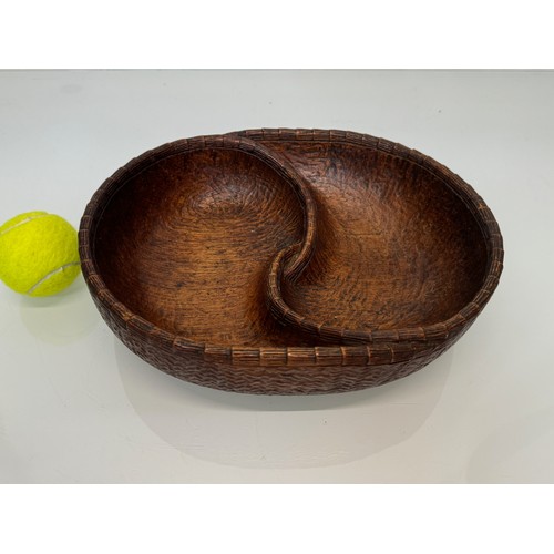 404 - Hand carved mid century wooden bowl of a yin and yang design, 31 cm x 25 cm x 7.5 cm.

This lot is a... 