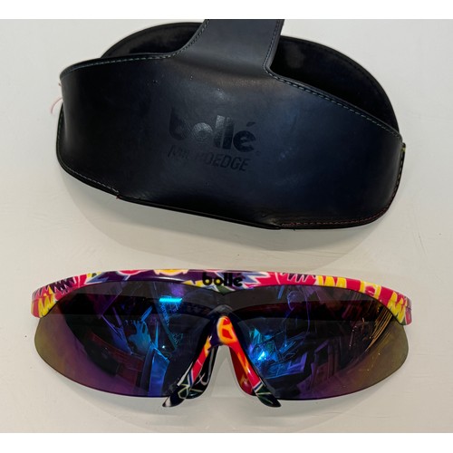 413 - Vintage ski wear, a cased pair of Bolle sunglasses, with alternative frame sections.

This lot is av... 