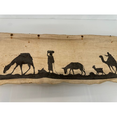 419 - Artwork, a Bedouin scene on linen, 109 cm x 27 cm.

This lot is available for in-house shipping