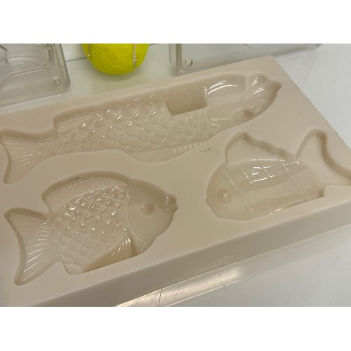 171 - Kitchenalia, three traditional Christmas chocolate moulds, Santa Claus, shoes and fish designs.

Thi... 