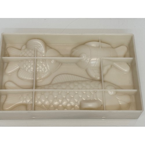 171 - Kitchenalia, three traditional Christmas chocolate moulds, Santa Claus, shoes and fish designs.

Thi... 