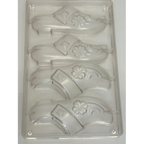 171 - Kitchenalia, three traditional Christmas chocolate moulds, Santa Claus, shoes and fish designs.

Thi... 