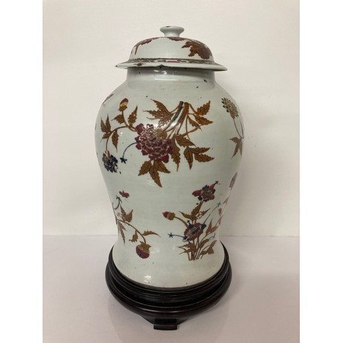 4 - Chinese pottery lidded vase on later stand, 16 inches high. Chip to underside of the lid and hairlin... 