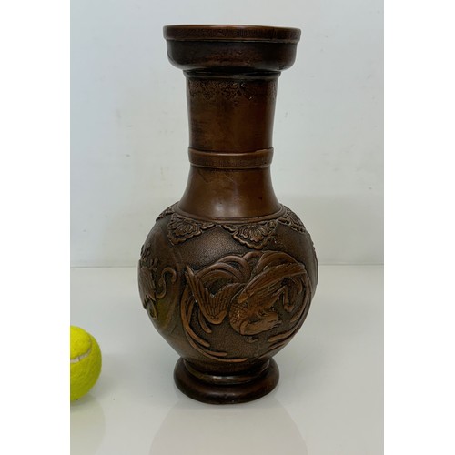 1 - Oriental copper vase with embossed decoration of birds and leaves, 32 cm tall x 18 cm in diameter.

... 