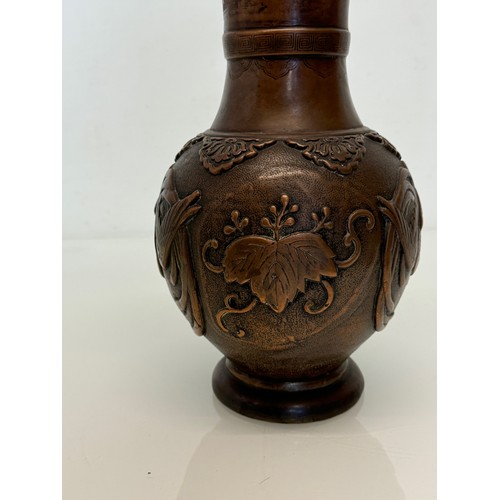 1 - Oriental copper vase with embossed decoration of birds and leaves, 32 cm tall x 18 cm in diameter.

... 