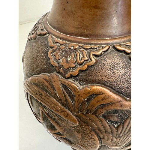 1 - Oriental copper vase with embossed decoration of birds and leaves, 32 cm tall x 18 cm in diameter.

... 