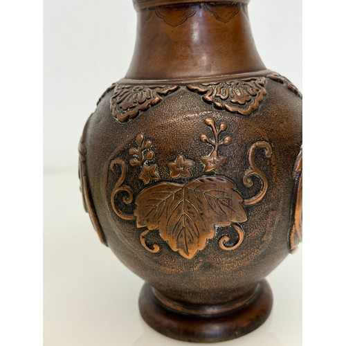 1 - Oriental copper vase with embossed decoration of birds and leaves, 32 cm tall x 18 cm in diameter.

... 