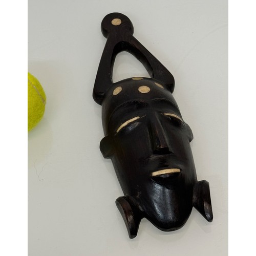 18 - Tribal Art, a hand carved hardwood head with bone inlays. 27 cm tall.

This lot is available for in-... 