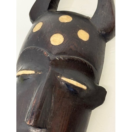 18 - Tribal Art, a hand carved hardwood head with bone inlays. 27 cm tall.

This lot is available for in-... 