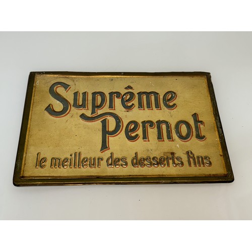 64 - Breweryana, an embossed and lithographed tin plate sign for Supreme Pernot, 43 cm x 28 cm.

This lot... 