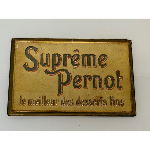 64 - Breweryana, an embossed and lithographed tin plate sign for Supreme Pernot, 43 cm x 28 cm.

This lot... 