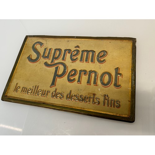 64 - Breweryana, an embossed and lithographed tin plate sign for Supreme Pernot, 43 cm x 28 cm.

This lot... 