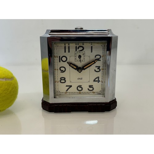 164 - Art Deco era bakelite and chrome cased alarm clock, 11 cm x 12 cm high.

This lot is available for i... 