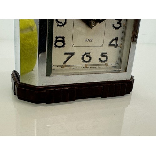 164 - Art Deco era bakelite and chrome cased alarm clock, 11 cm x 12 cm high.

This lot is available for i... 