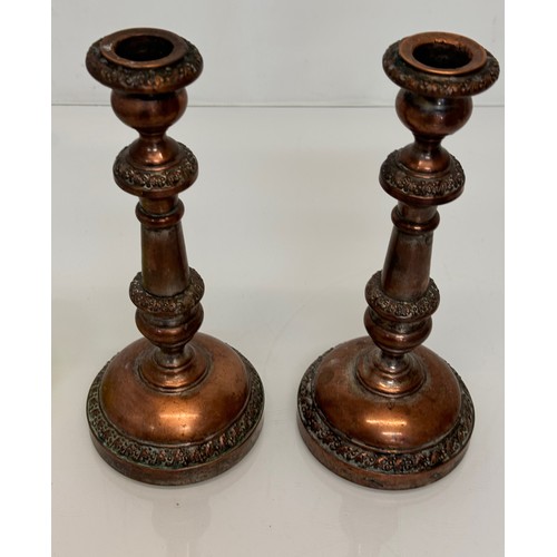 181 - A pair of cast copper candle stands, 25 cm tall.

This lot is available for in-house shipping