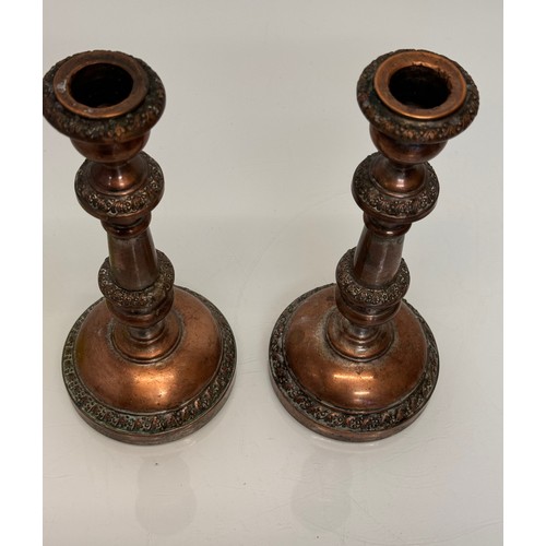 181 - A pair of cast copper candle stands, 25 cm tall.

This lot is available for in-house shipping