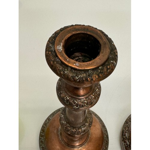 181 - A pair of cast copper candle stands, 25 cm tall.

This lot is available for in-house shipping