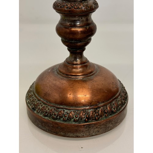 181 - A pair of cast copper candle stands, 25 cm tall.

This lot is available for in-house shipping