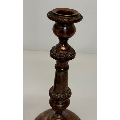 181 - A pair of cast copper candle stands, 25 cm tall.

This lot is available for in-house shipping