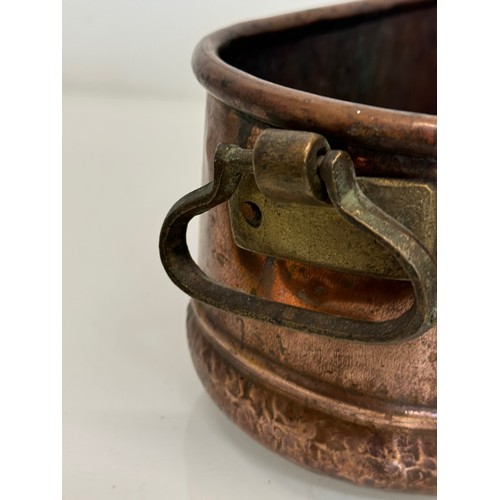 182 - A copper planter with cast brass handles, 40 cm x 17 cm x 14cm high.

This lot is available for in-h... 